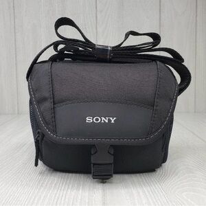 Sony black camera bag. Durable material. Secure strap and buckle. NWOT